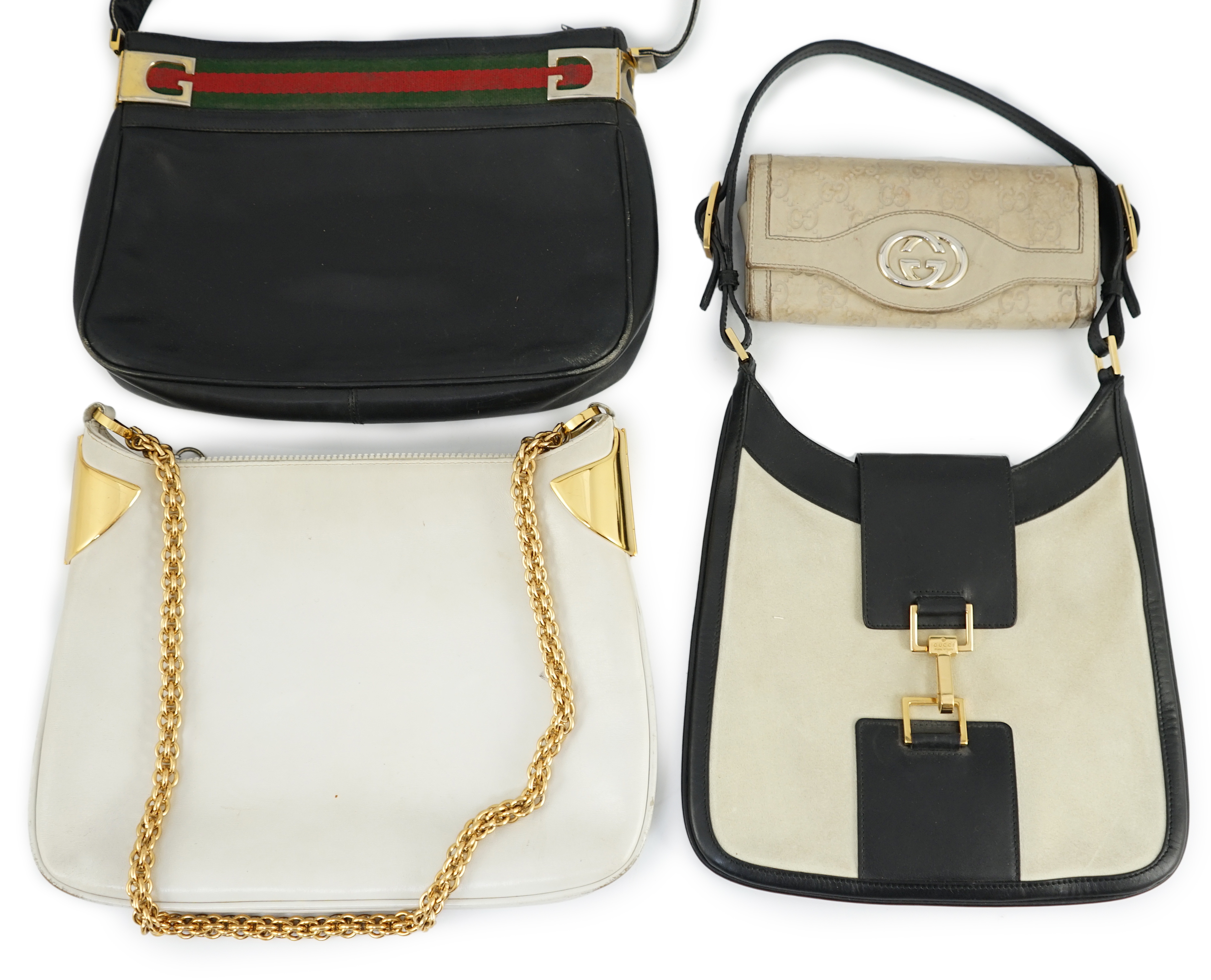Three vintage Gucci hand bags and clutch wallet